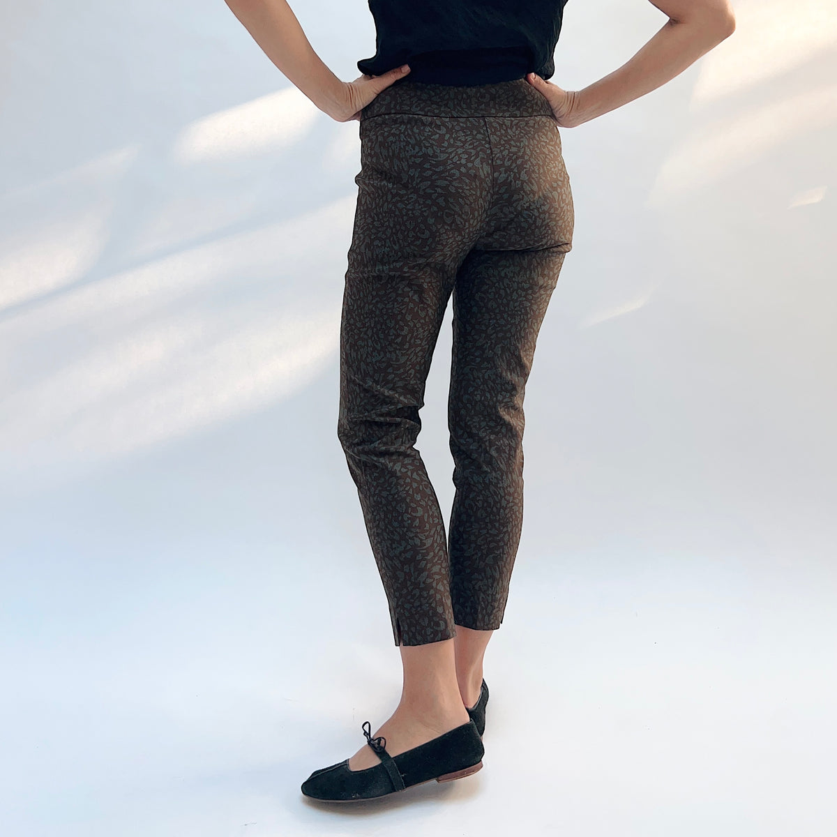 Lisette Sepia Leopard Slim Ankle Pant, back view showing the back pockets and slim ankle silhouette in sepia leopard print