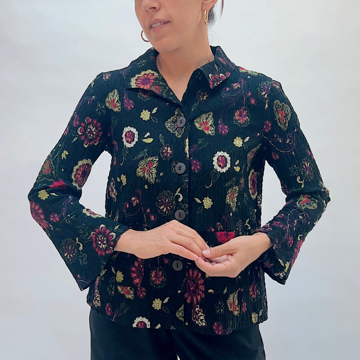 Habitat Floral Crinkle Cotton Flounce Shirt in Black, front close-up view showing the button-front detail, point collar, and crinkle cotton floral fabric