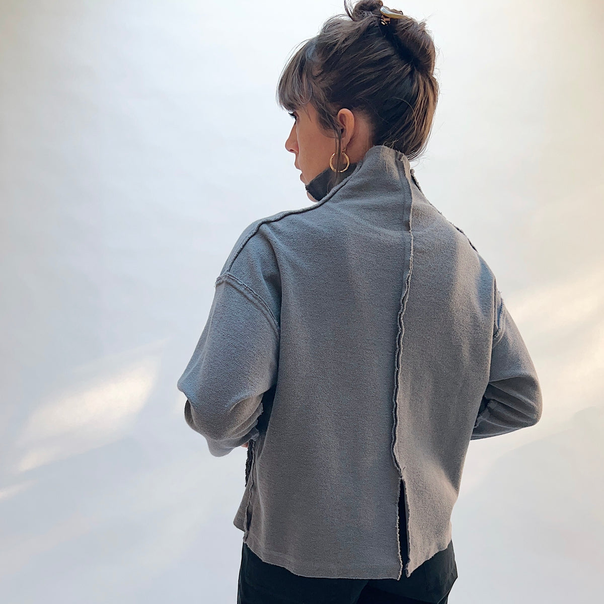 Eleven Stitch Funnel Jacket in Eiffel Tower, back view showing the center back seam and relaxed boxy silhouette in slate blue-gray cotton terry