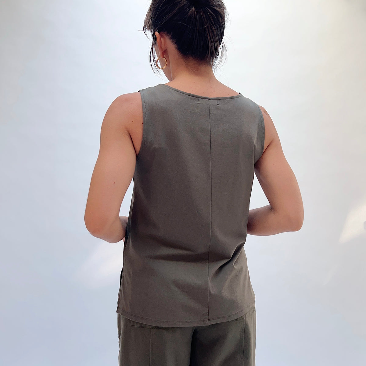 Habitat Core Travel Easy Tank in Umber, back view showing the center back seam detail and longline silhouette