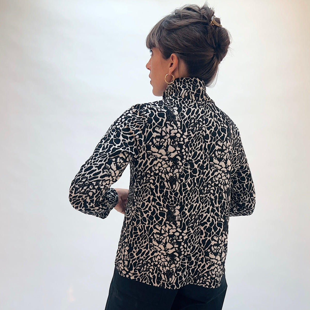 Habitat Spot on Cropped Jacket in Dove, back view showing the cropped silhouette and all-over abstract spot jacquard print