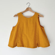 Load image into Gallery viewer, Yellow sleeveless top on a wooden hanger against a white background