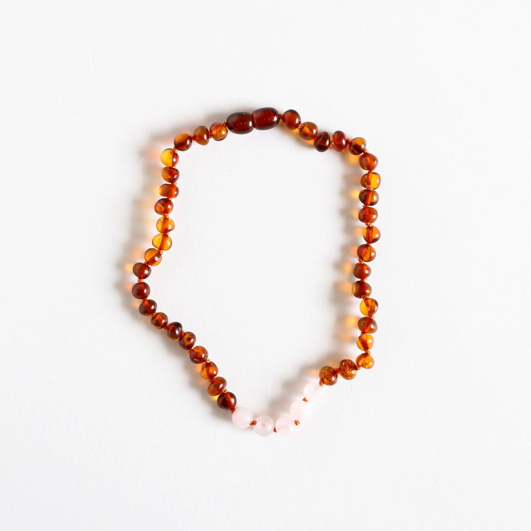 Necklace with amber beads on a white background