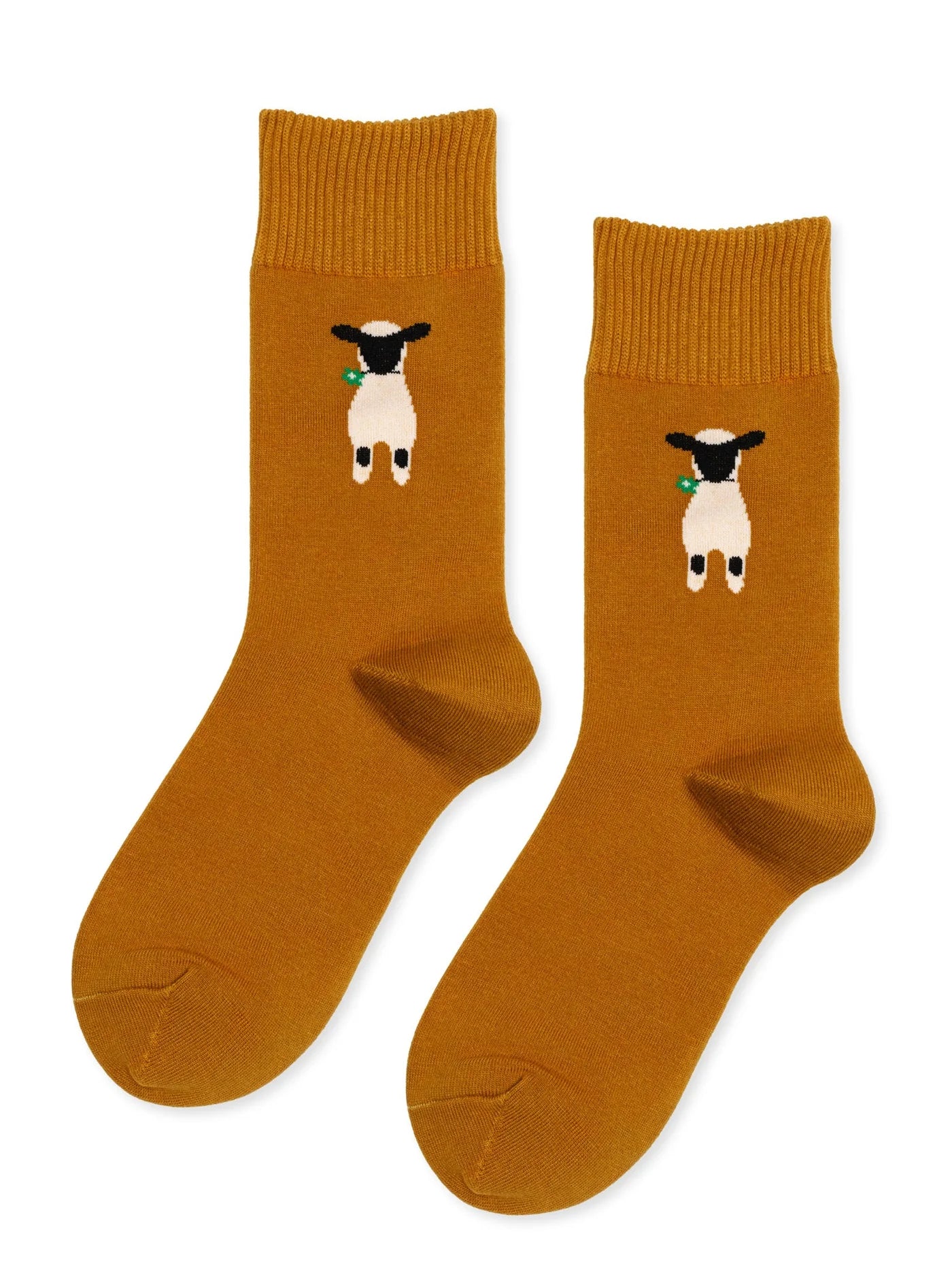 Nice to See Ewe Crew socks in Ochre — warm golden ochre cotton crew with white and black lamb motif holding a green flower, flat lay product shot on white background