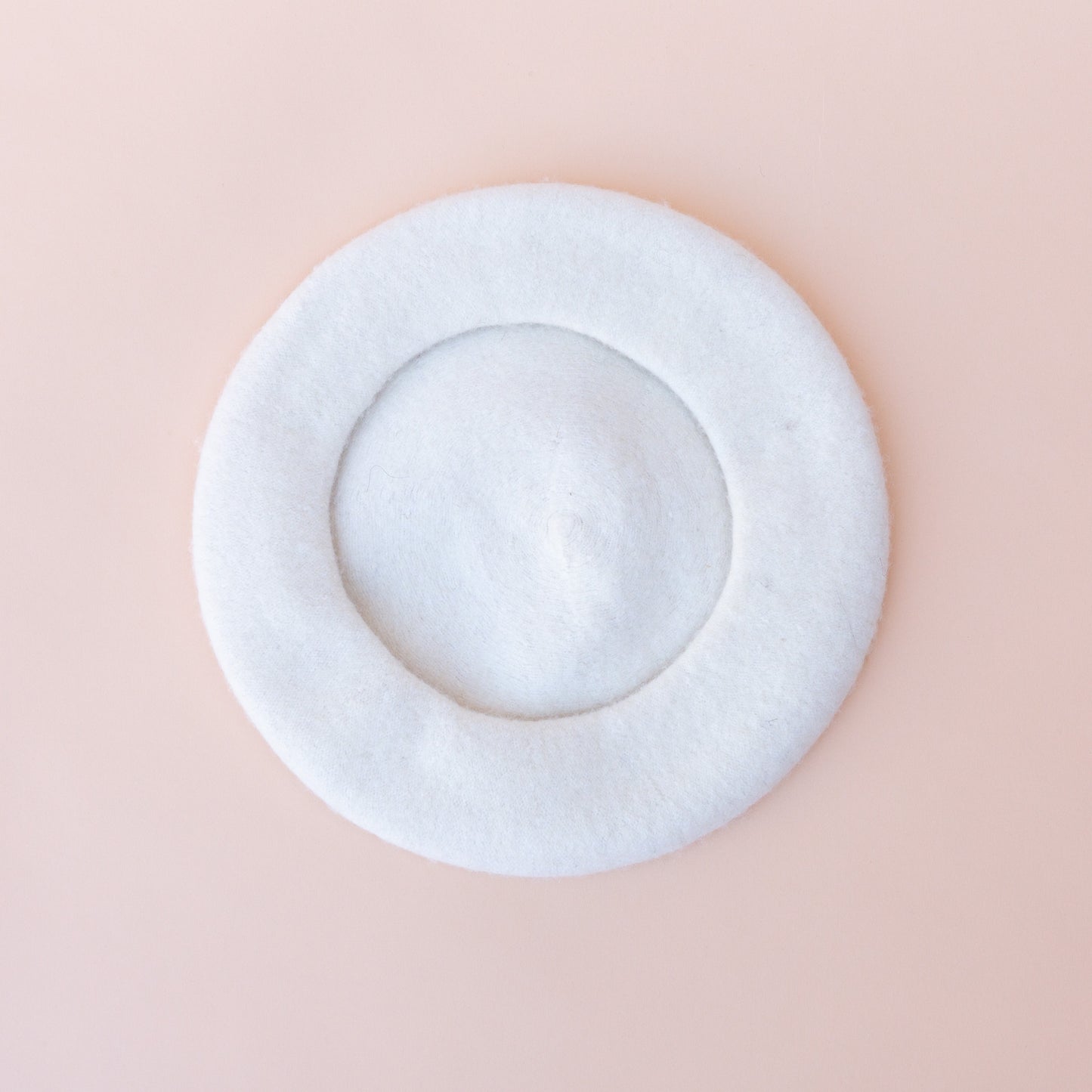 bottom of wool beret in white