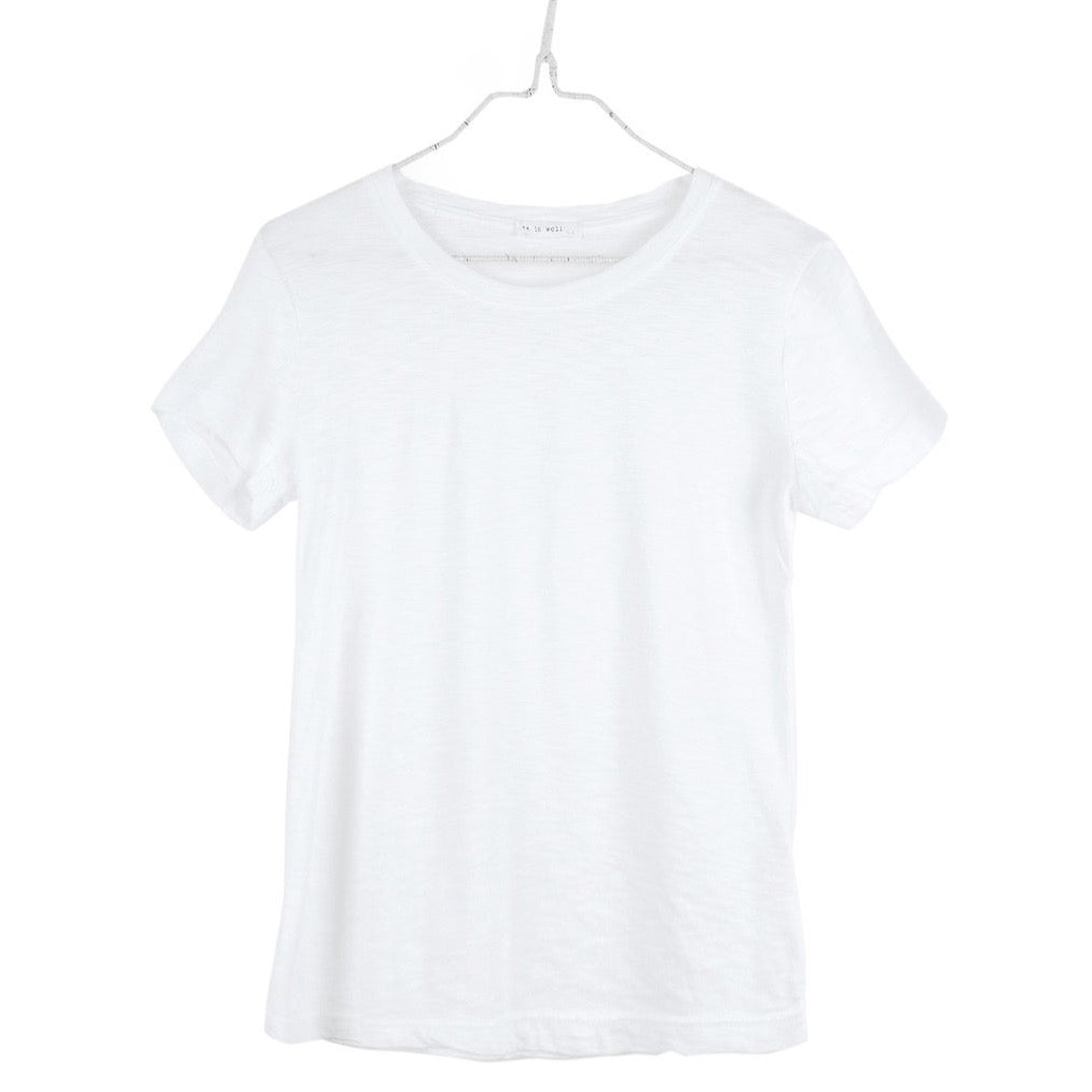 It Is Well Everyday Crewneck Tee in Salt, flat hanger shot on white background showing crisp white lightweight slub jersey with It Is Well label at crew neck, short sleeves with slight cuff, and relaxed full-length silhouette