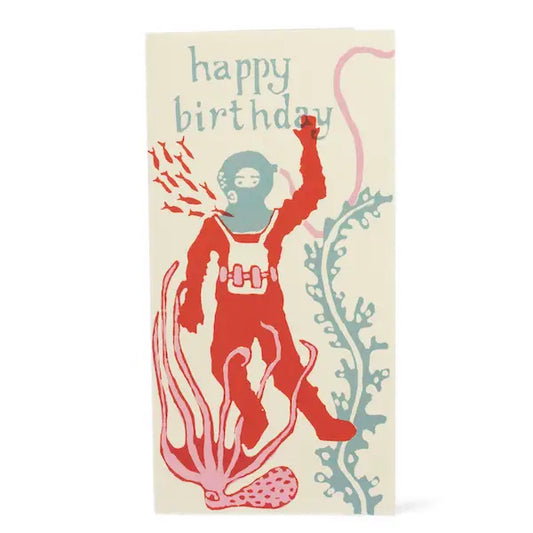 A blue and red deep sea diver and text that says happy birthday on a tall card shot against a white background.