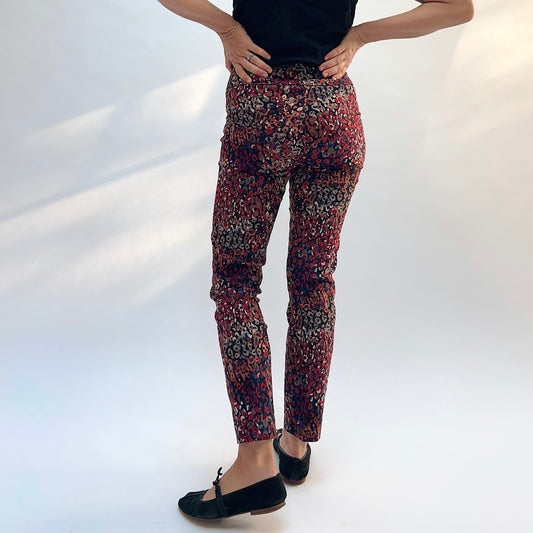Lisette Mixed Leopard Slim Ankle Pant, back view showing the slim silhouette and multicolor leopard print in reds, pinks, navy, and tan
