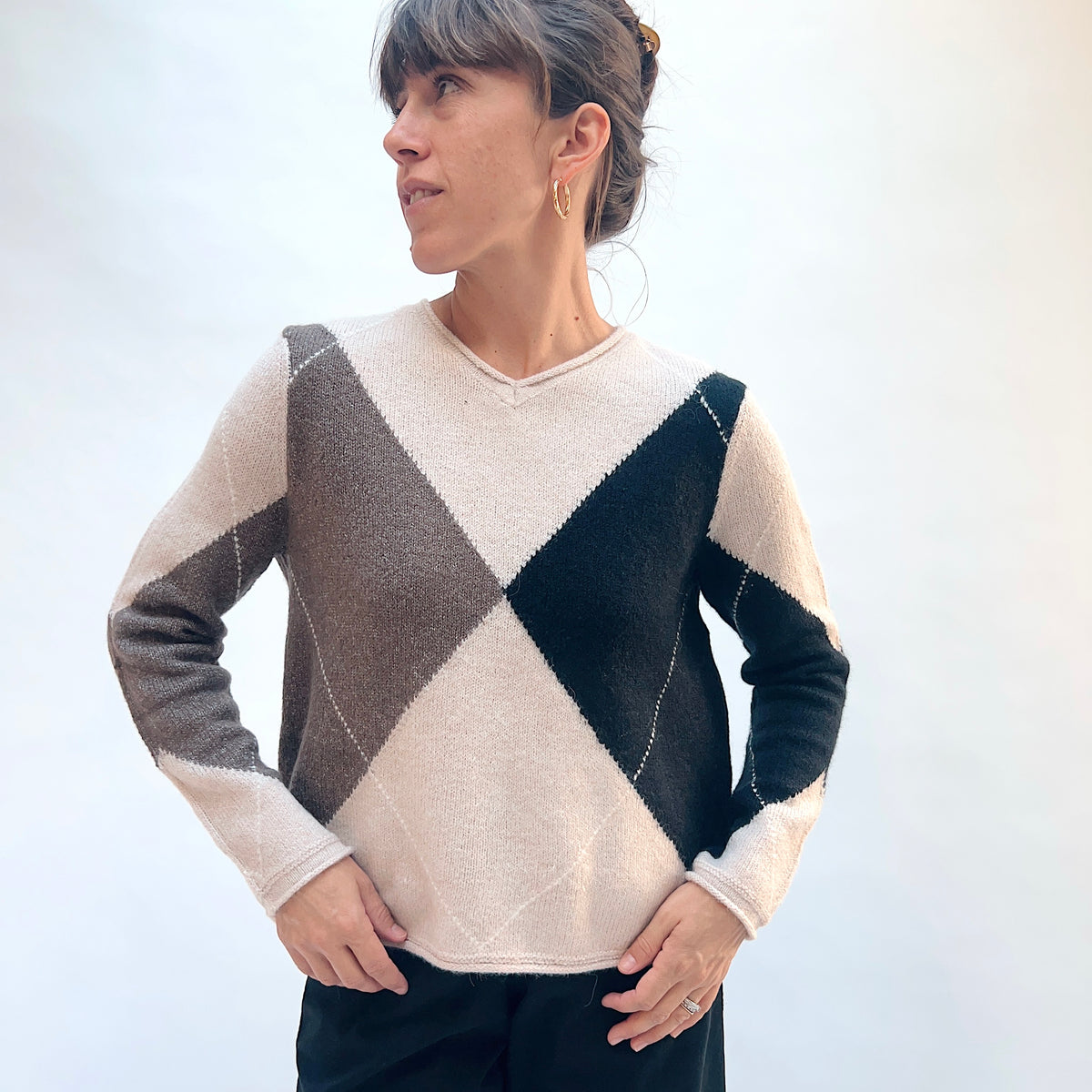 Habitat Alpine Argyle Pullover in Dove, front view showing the relaxed boxy fit and large argyle diamond blocks in navy and taupe
