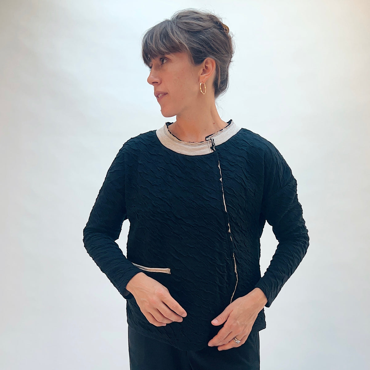 Habitat Crinkled Double Face Metro Pullover in Black, front side view showing the relaxed metro silhouette and contrast crew collar
