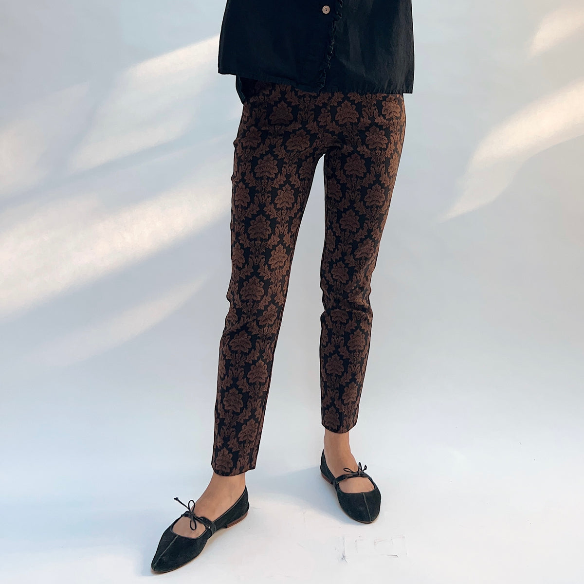 Lisette Chocolate Brocade Cigarette Pant, front full-length view showing the slim cigarette silhouette and damask brocade pattern
