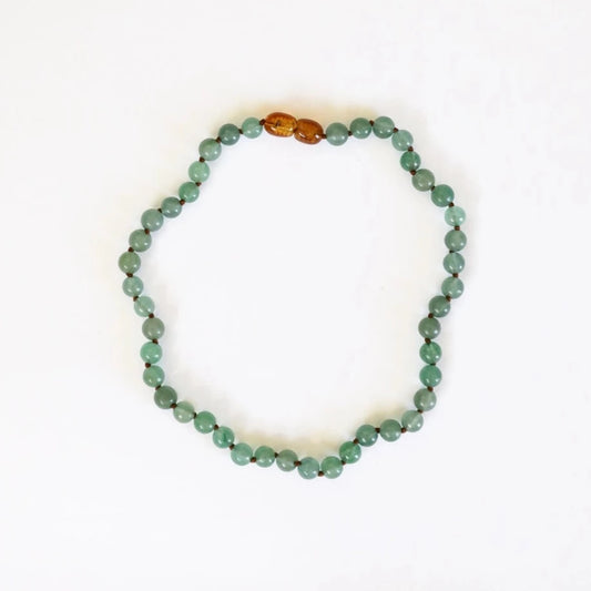 CanyonLeaf Pure Gemstone Aventurine Necklace — a hand-knotted necklace of smooth sage green aventurine beads with a honey amber screw clasp, laid flat on a white background.