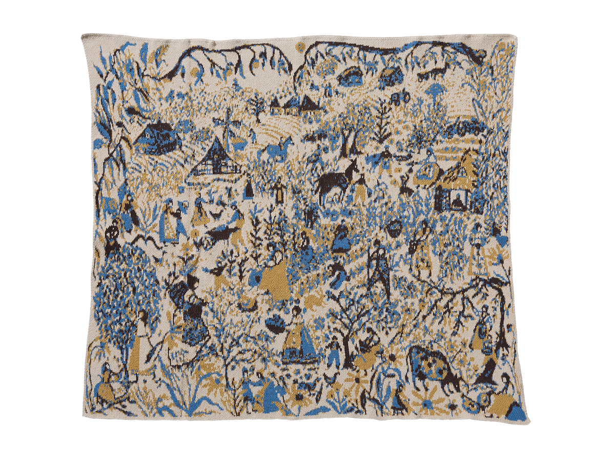 Farmscape Straw child blanket laid flat, with people, animals, houses, and trees in blue, yellow, and brown on cream.
