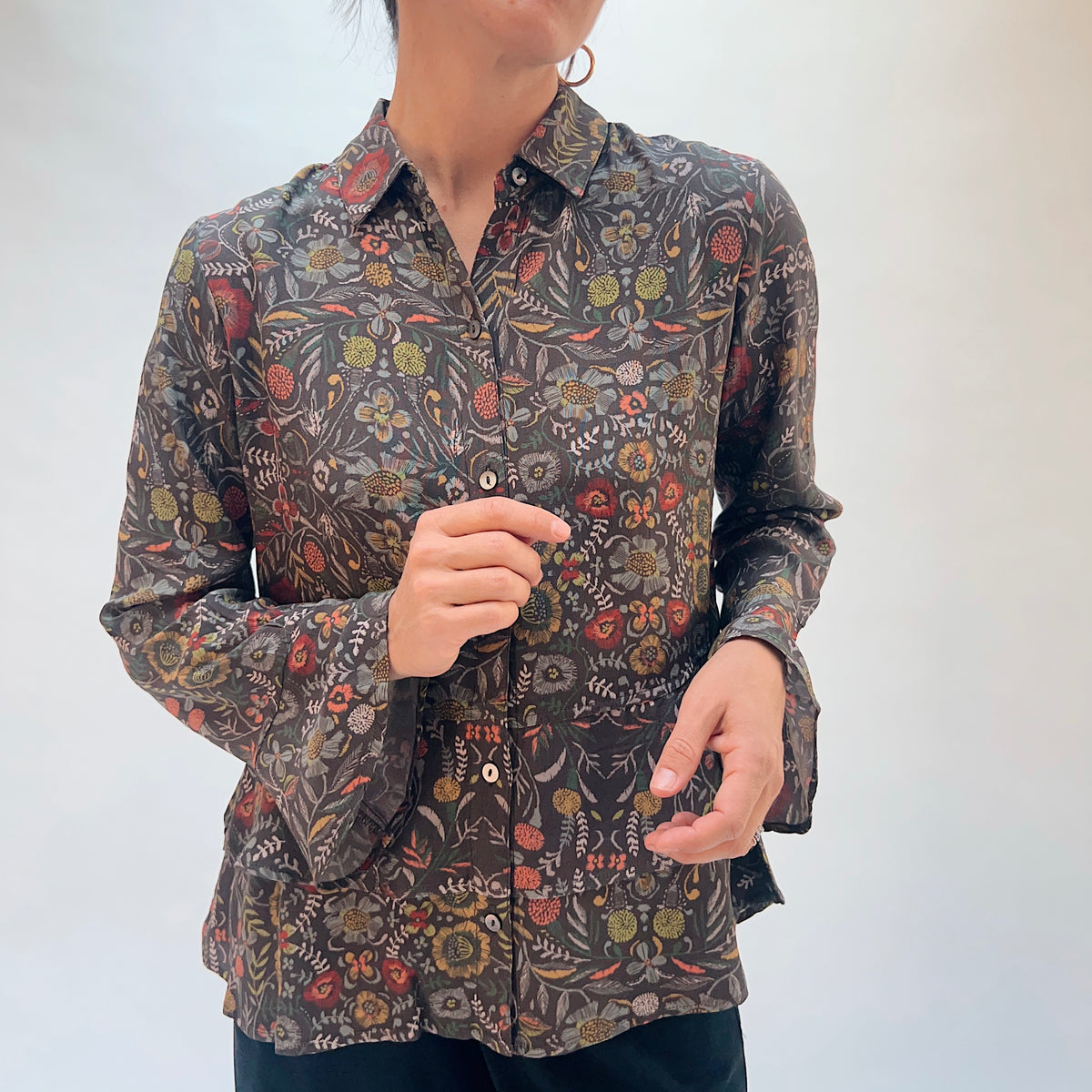 Habitat Crepe Garden Flounce Shirt in Olive, front close-up showing the point collar, button-front detail, and garden floral print on olive crepe
