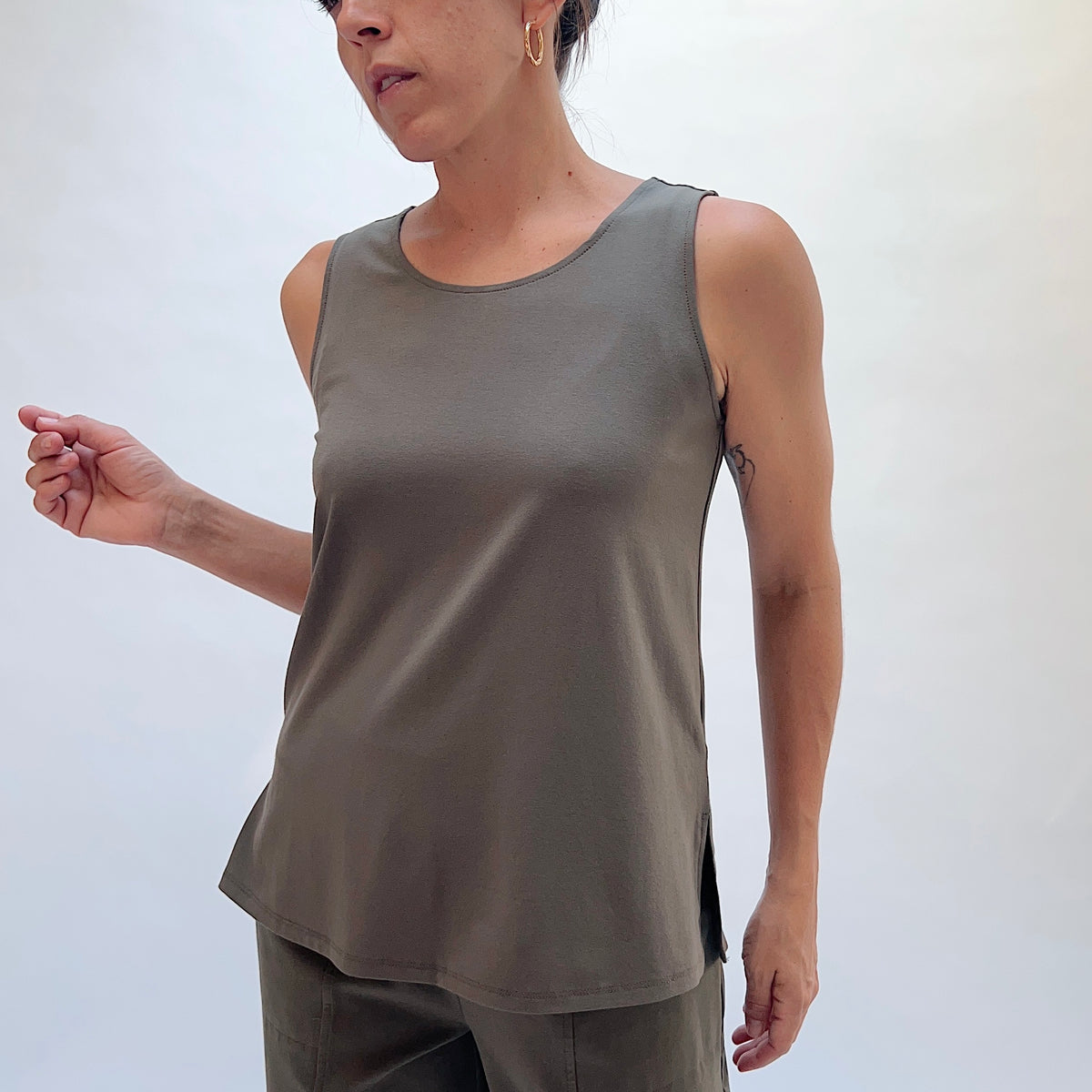 Habitat Core Travel Easy Tank in Umber, front close-up showing the scoop neckline and relaxed fit in umber rayon

