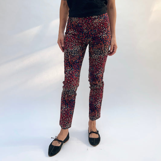 Lisette Mixed Leopard Slim Ankle Pant, front view showing the pull-on waistband and slim ankle fit in vibrant multicolor leopard print
