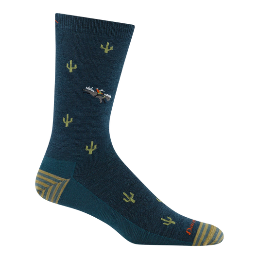 Darn Tough dark teal crew sock with green cacti, a cowboy riding a bucking horse, and striped heel and toe panels.
