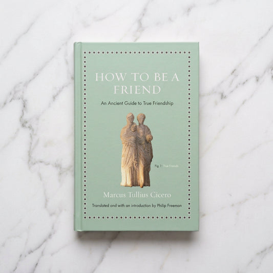 Pale green cover of How to Be a Friend by Marcus Tullius Cicero, translated by Philip Freeman, with a sculpture of two figures.
