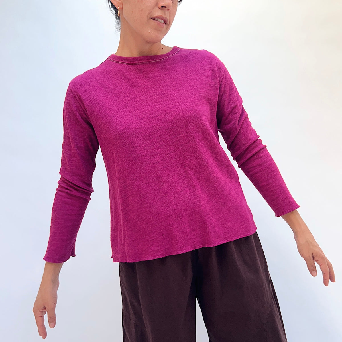 North Star Base Double Cotton Tee in Beet, front view showing the relaxed fit and raw-edge hem in beet pink
