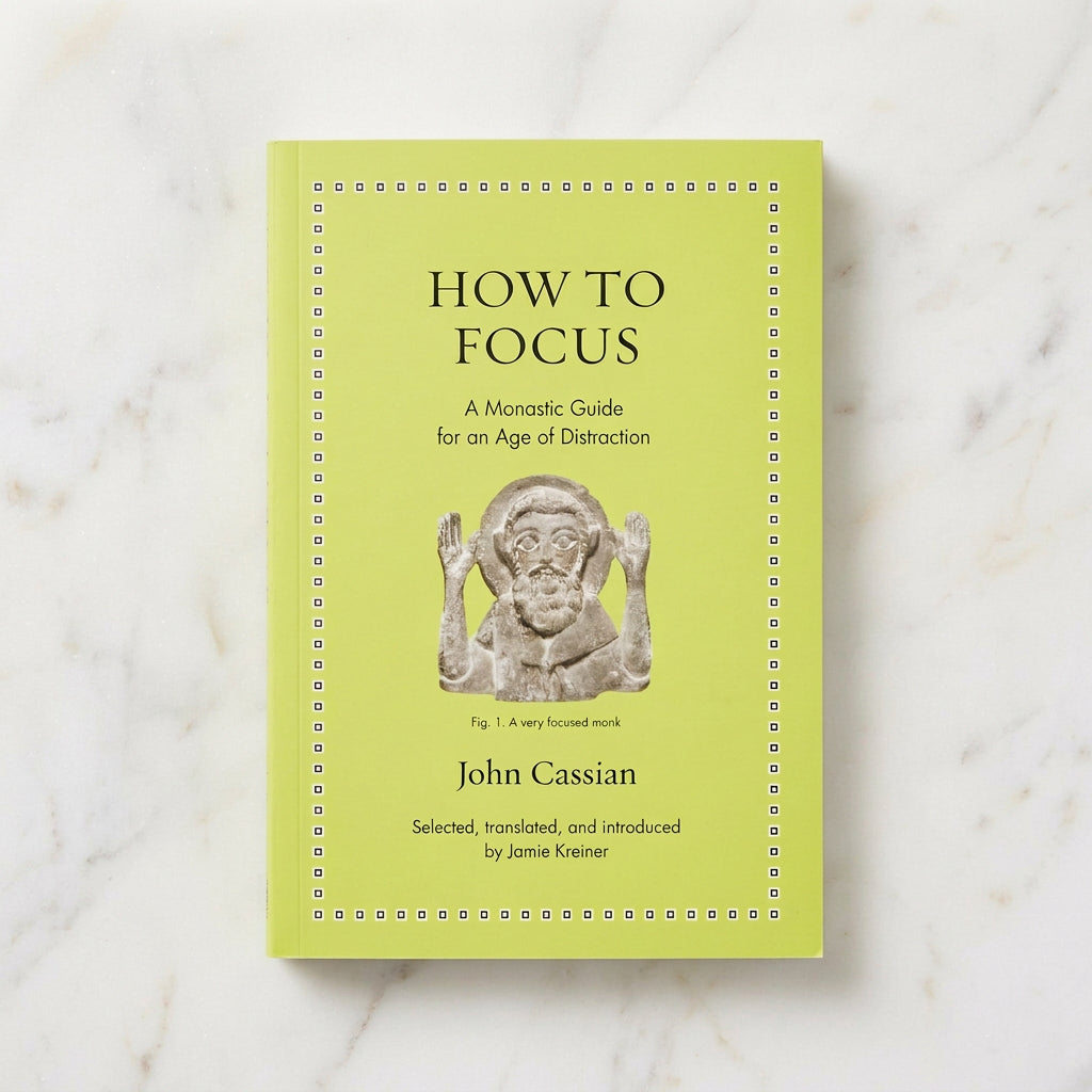 Yellow-green cover of How to Focus by John Cassian, translated by Jamie Kreiner, featuring a sculpted monk with both hands raised.
