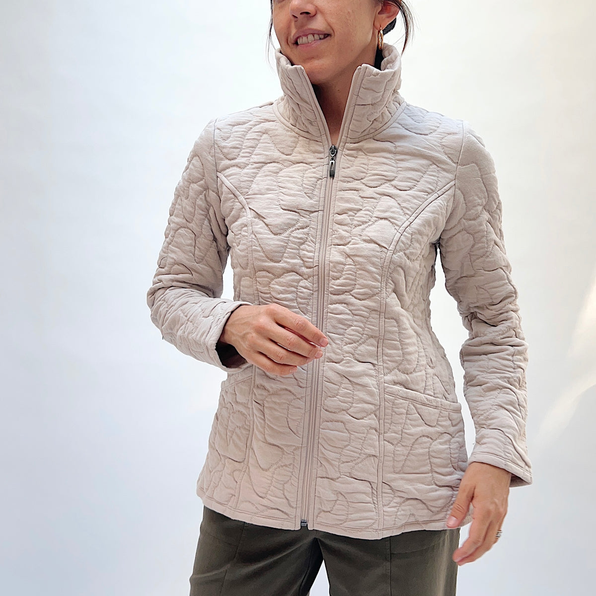 Habitat Cascade Quilted Coat in Dove, front close-up view showing the zip-front detail, stand collar, and abstract quilting texture

