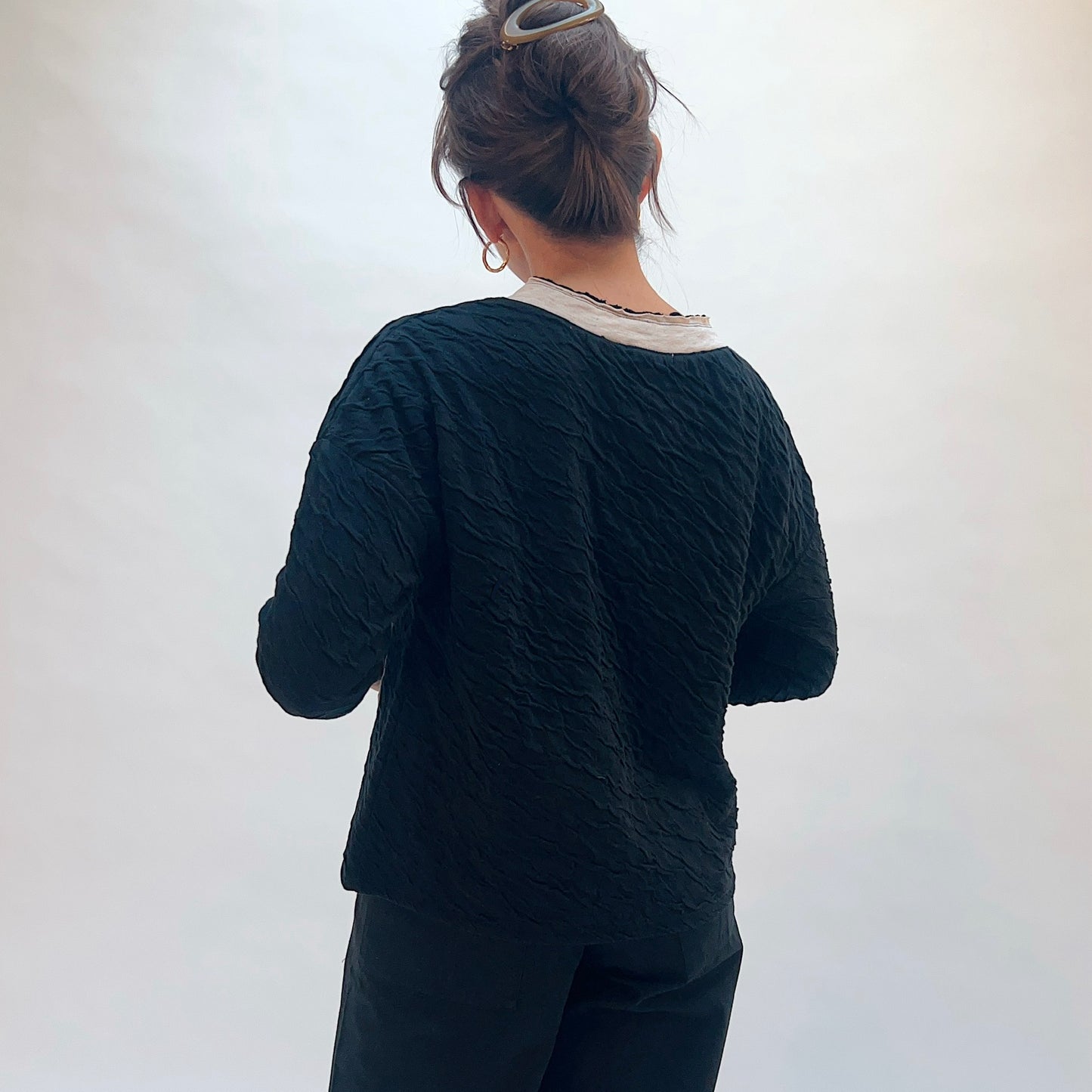 Habitat Crinkled Double Face Metro Pullover in Black, back view showing the crinkled double face fabric texture and contrast crew collar with lettuce edge trim

