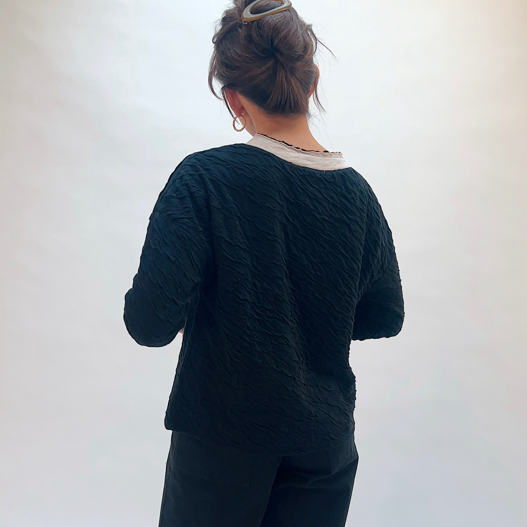 Habitat Crinkled Double Face Metro Pullover in Black, back view showing the crinkled double face fabric texture and contrast crew collar with lettuce edge trim
