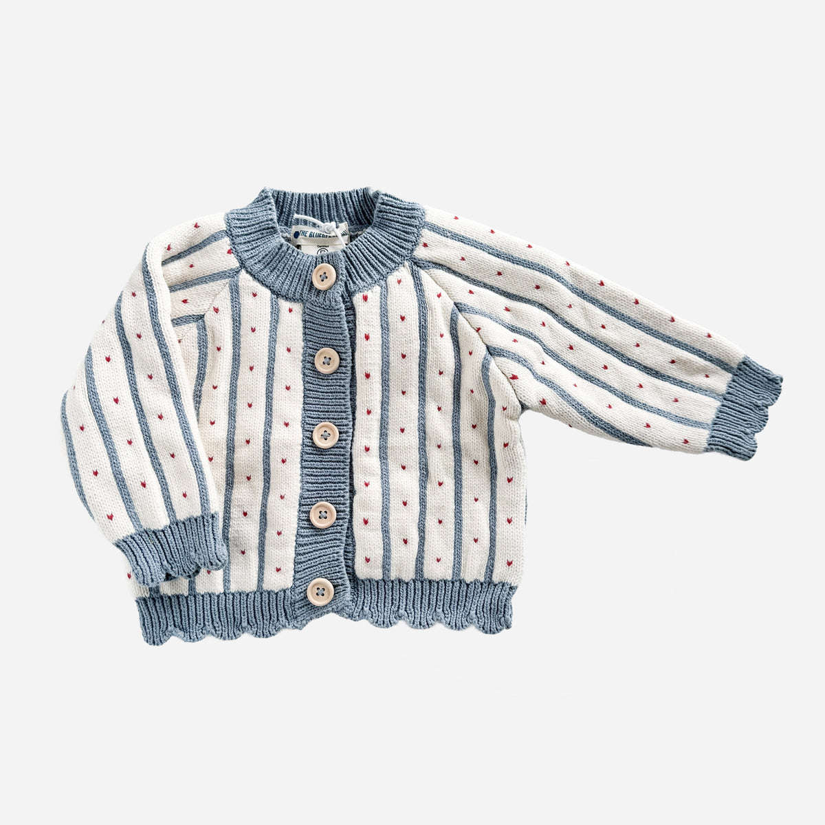 Children's cardigan with blue and white striped pattern on a light gray background