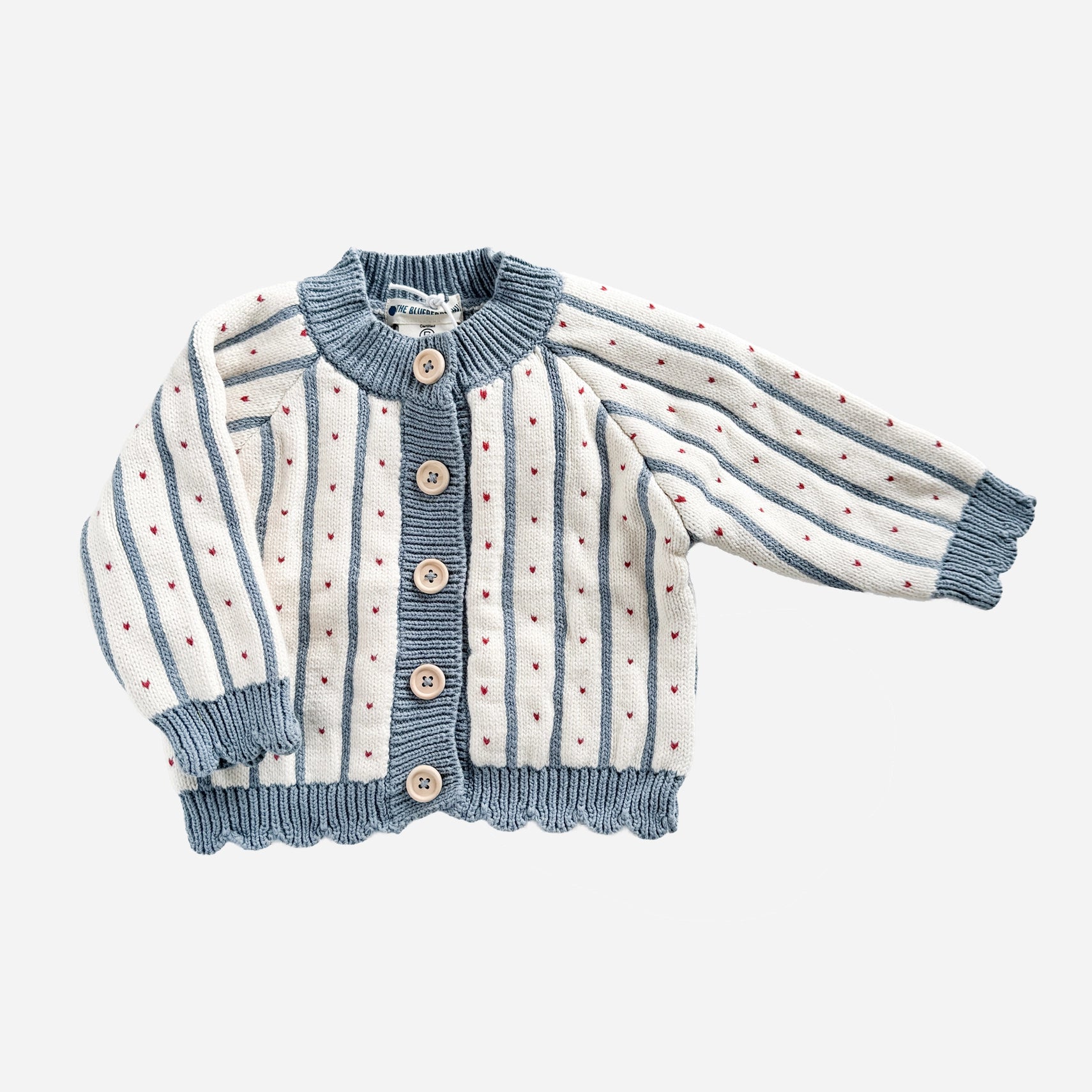 Children's cardigan with blue and white striped pattern on a light gray background
