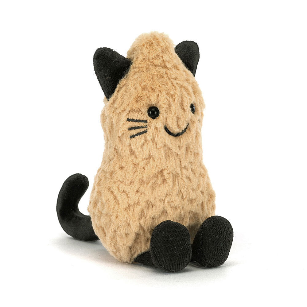 Jellycat Amuseables Peanut Cat plush toy seated on a white background, showing its golden textured body, black ears, embroidered whiskers and smile, black paws, and curled black tail