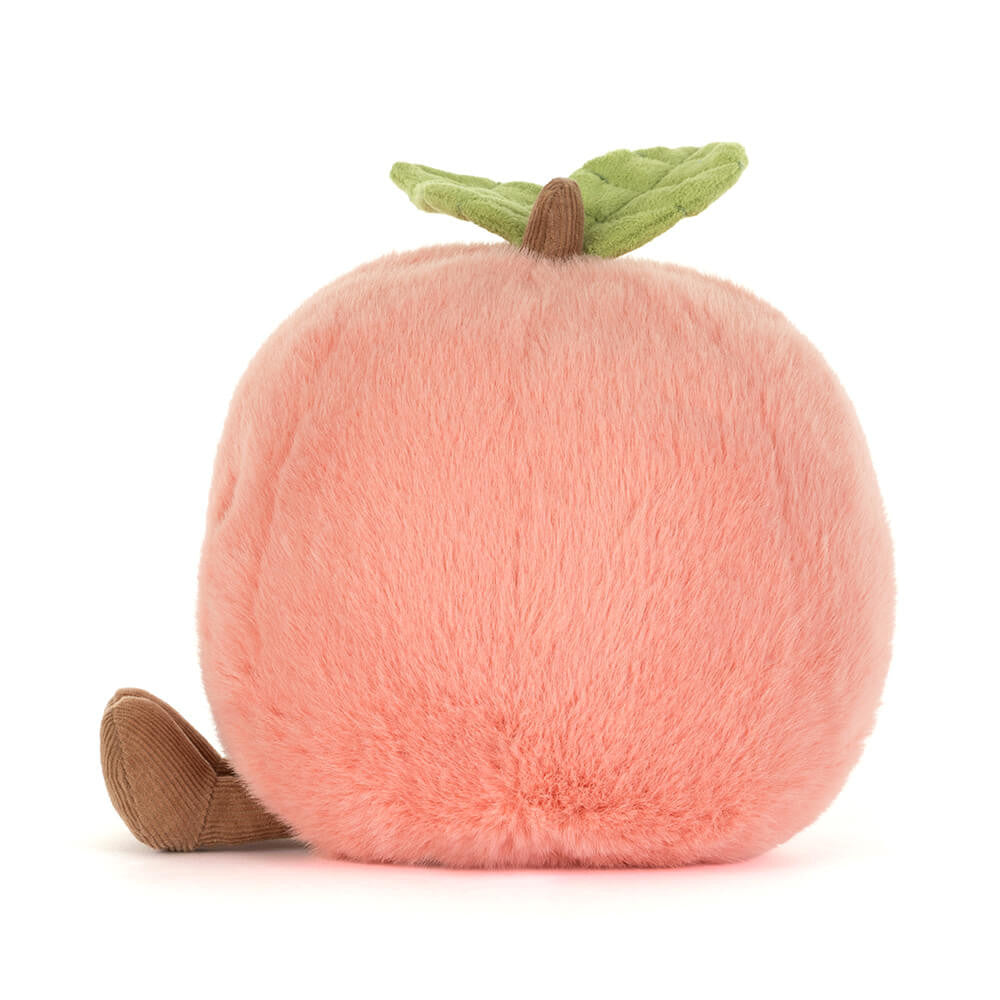 Jellycat Amuseables Peach plush toy — back side view showing soft blush pink texture, green leaf stem, and corduroy foot, on white background