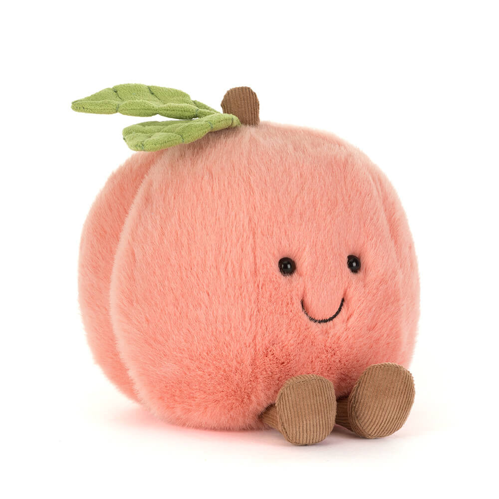 Jellycat Amuseables Peach plush toy — front three-quarter view showing smiling face, green leaf stem, and corduroy feet, on white background