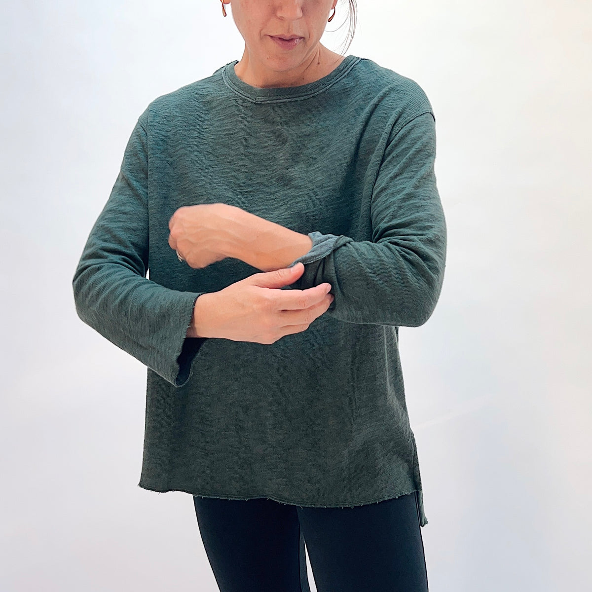 North Star Base Double Cotton Beach Tee in Konbu, front view showing the relaxed fit and raw-edge hem finish in konbu green
