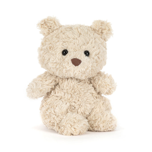 Jellycat Bartholomew Bear Junior, a small cream curly-furred plush teddy bear with black bead eyes and a brown nose, seated upright on a white background