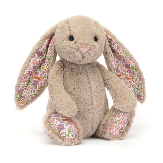 Jellycat Blossom Beige Bunny 'Petal' Original — a soft beige plush bunny seated upright with long floppy ears lined in a white floral fabric with pink, purple, and orange flowers and green leaves, a pink embroidered nose, black hard eyes, and matching floral paw pads, on a white background