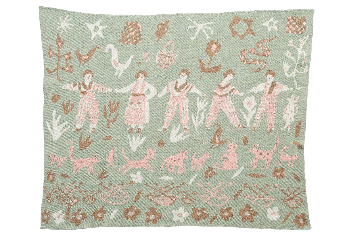 Forest Friends Sky child blanket laid flat, with pink figures and animals, white birds, and brown baskets on pale green.
