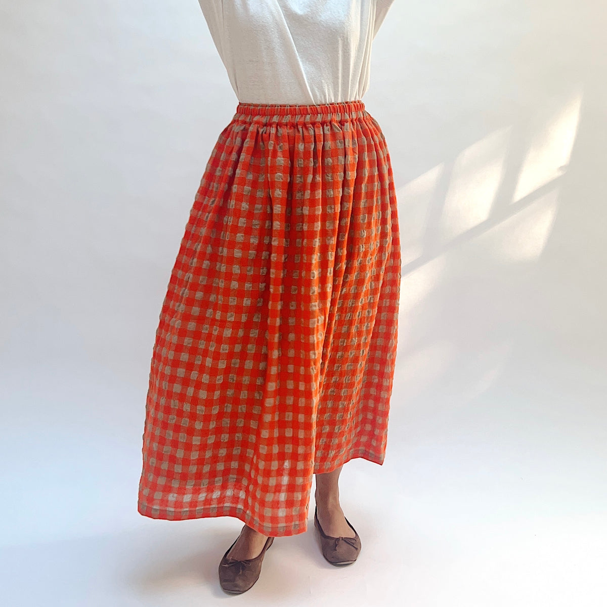 Ichi Antiquités Gingham Wool Check Skirt in Beige & Orange, closer front view showing the waistband and beige checks.
