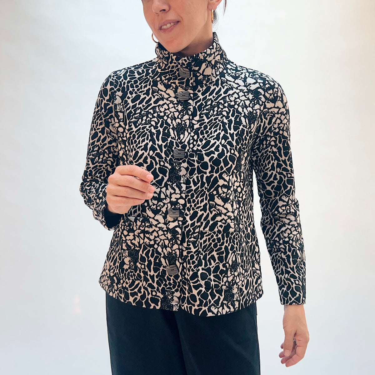 Habitat Spot on Cropped Jacket in Dove, front close-up showing the button detail and abstract spot jacquard print in black and taupe
