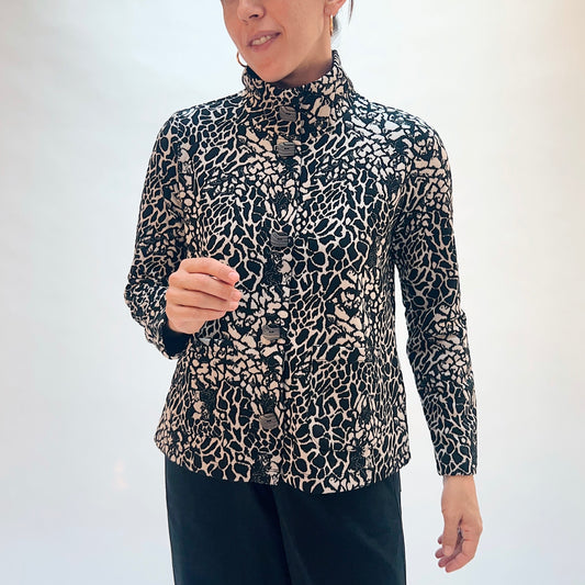 Habitat Spot on Cropped Jacket in Dove, front close-up showing the button detail and abstract spot jacquard print in black and taupe
