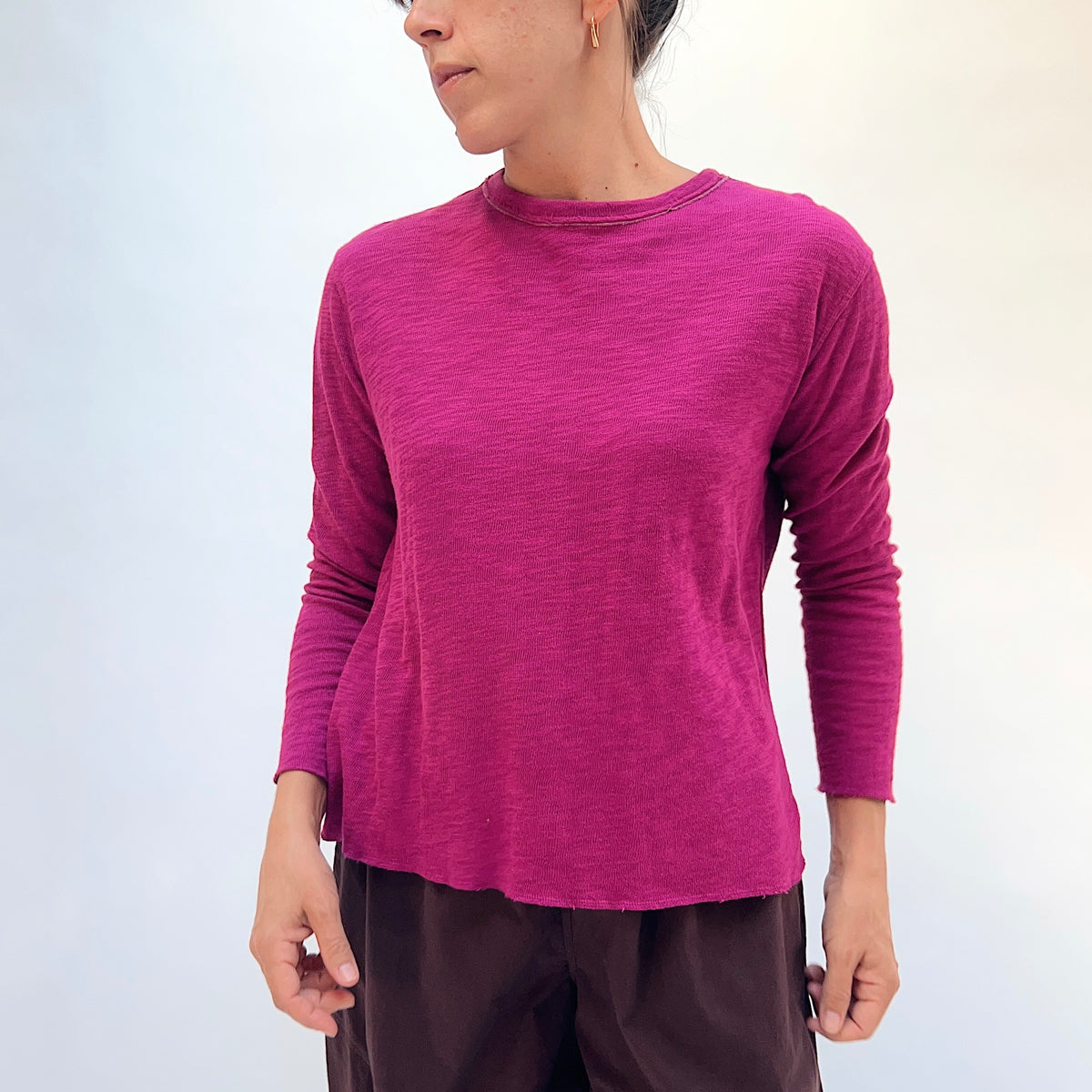 North Star Base Double Cotton Tee in Beet, front view showing the crew neck with raw-edge finish and slightly cropped sleeves in beet pink
