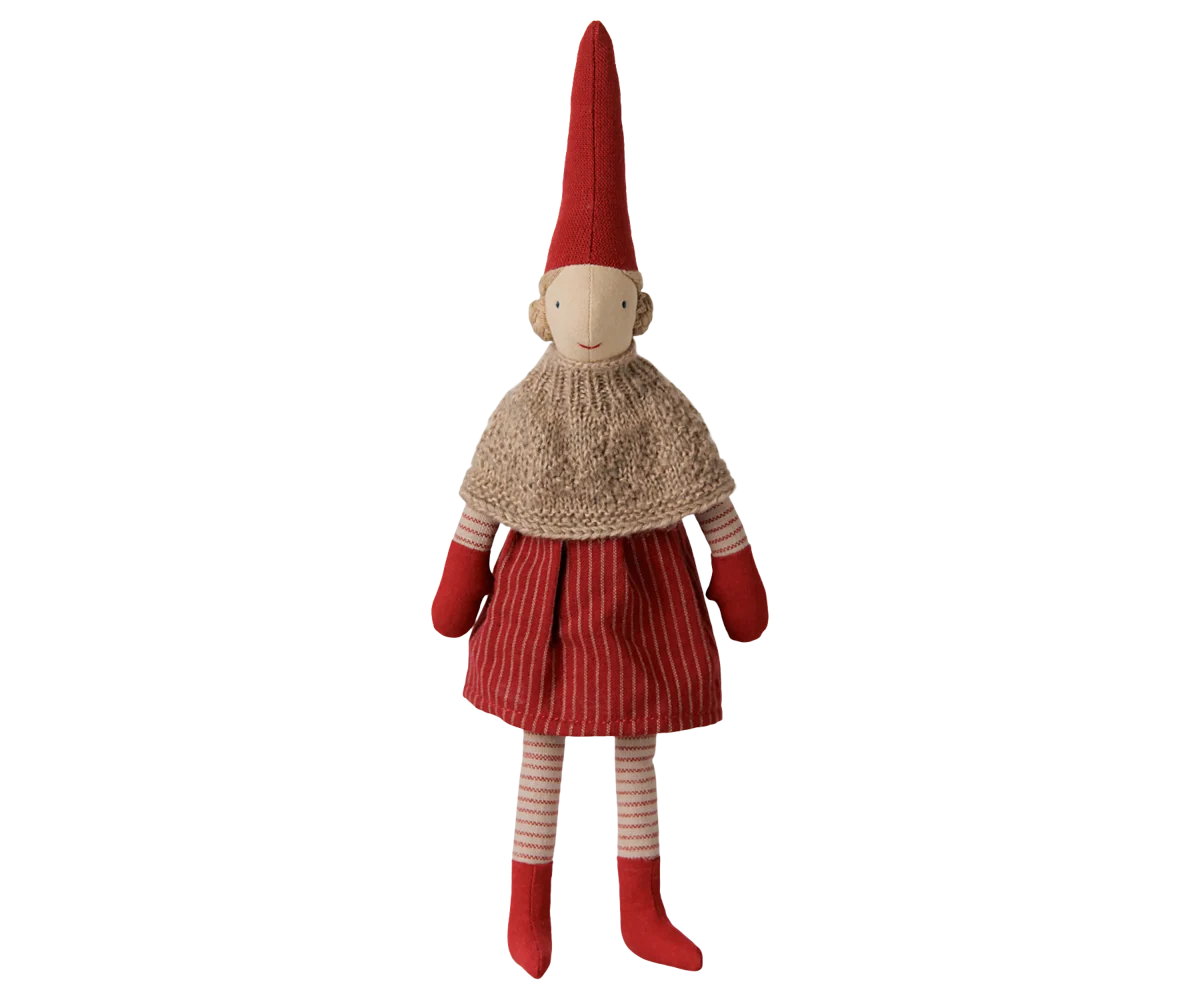 Maileg Pixy Girl, size 2, wearing a beige knitted cape, red striped skirt, tall red hat, red mittens, and red boots.
