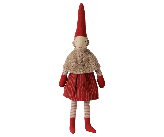 Maileg Pixy Girl, size 2, wearing a beige knitted cape, red striped skirt, tall red hat, red mittens, and red boots.
