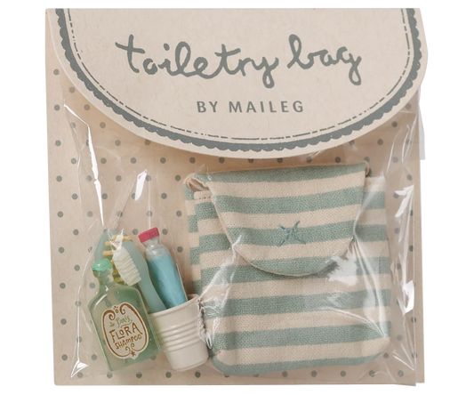 Maileg Toothbrush Set in Blue Striped Bag — product in original Maileg packaging showing the blue and cream striped cotton bag with miniature accessories including a Flora Shampoo bottle, toothbrush, toothpaste tube, and ribbed water cup
