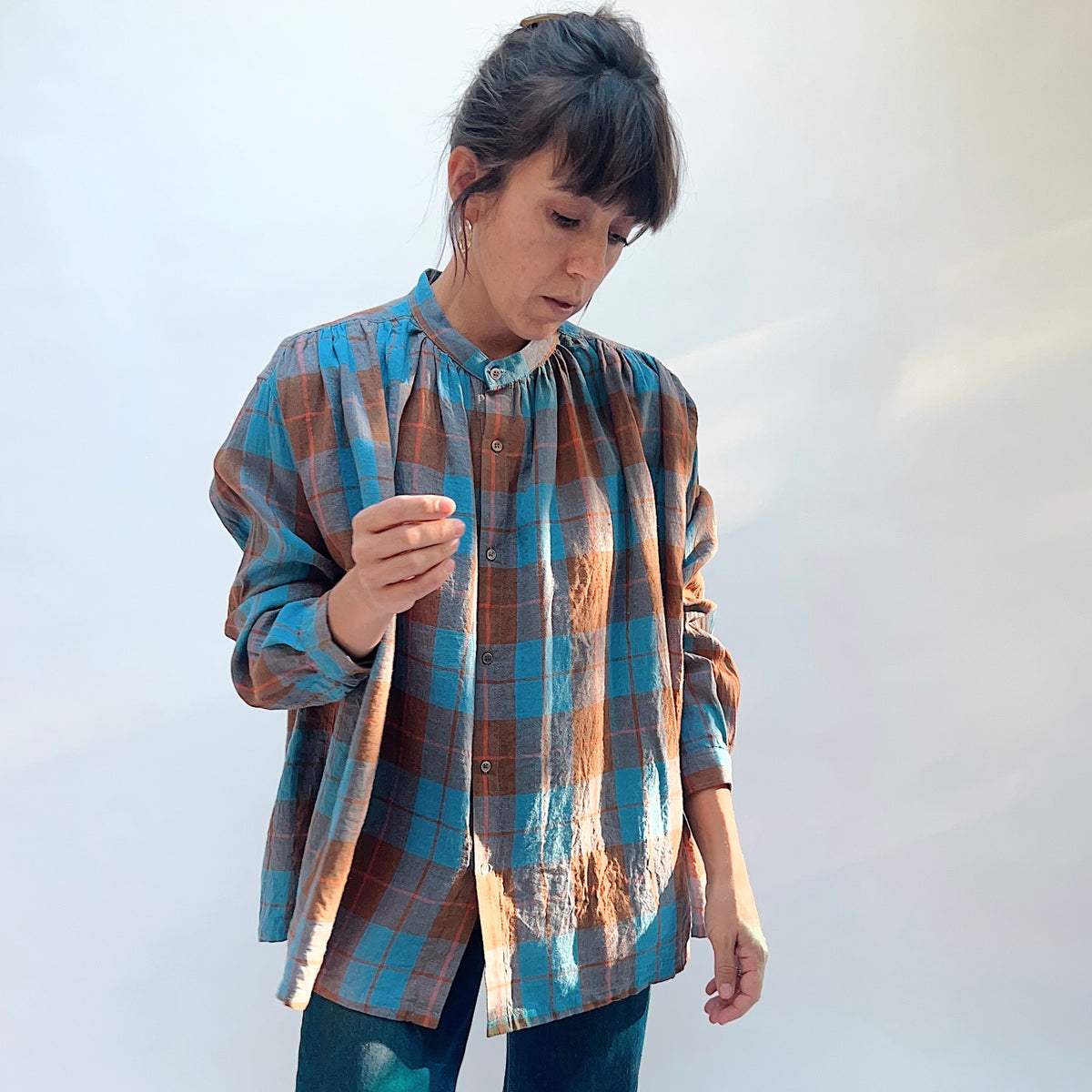 Ichi Antiquités Woven Plaid Check Shirt in Blue, angled front view showing the button front and blue, brown, and gray plaid.
