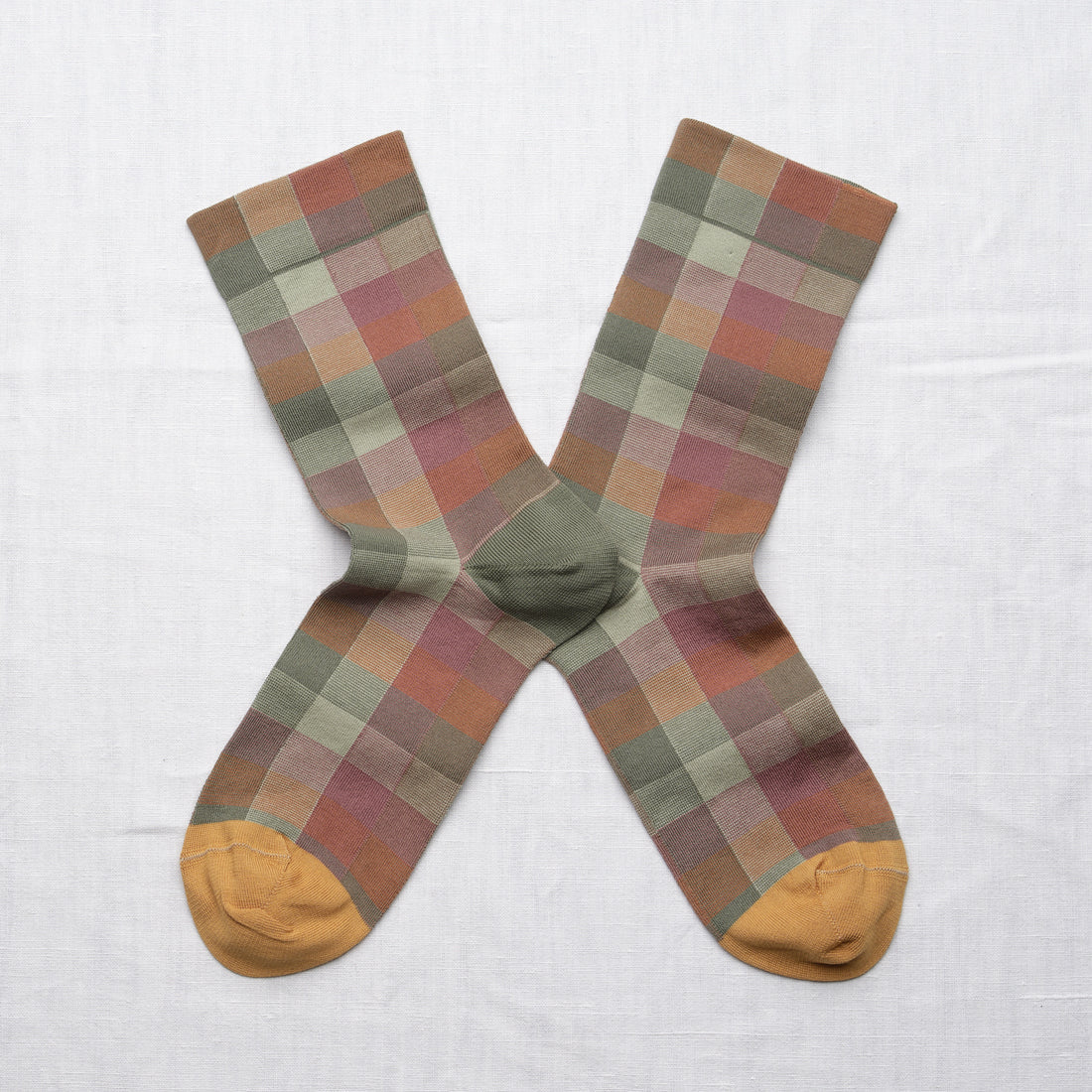 Bonne Maison Sunday Plaid Socks, flat lay pair showing the large-scale plaid in sage, dusty rose, terracotta, and cream with mustard toe
