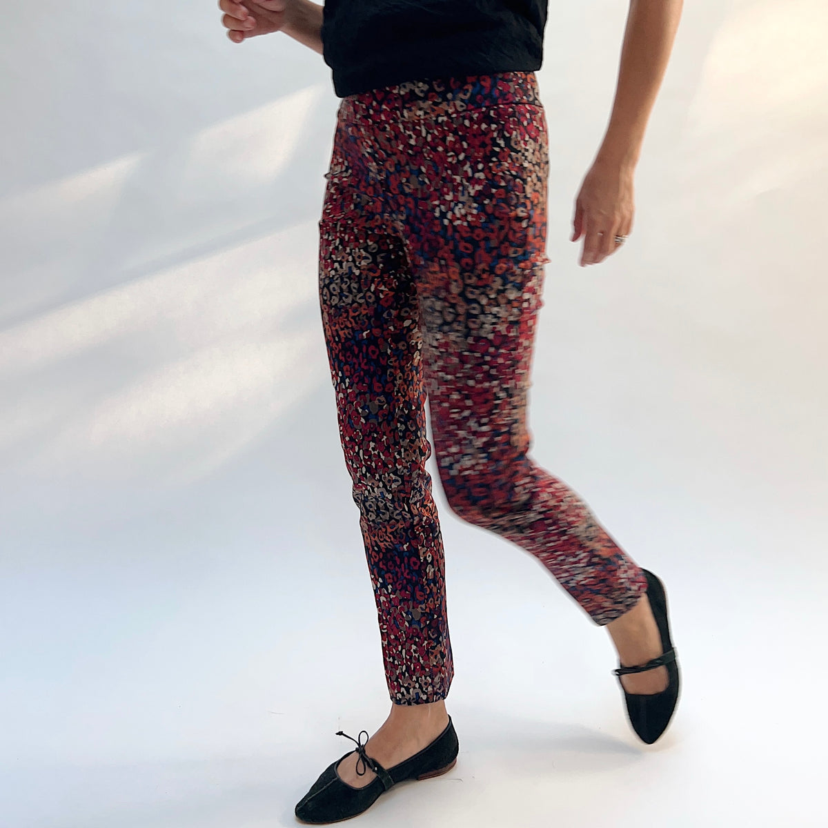 Lisette Mixed Leopard Slim Ankle Pant, front view in motion showing the slim cigarette silhouette and multicolor leopard print
