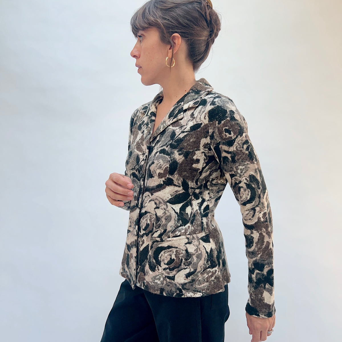 Habitat Aspen Peplum Jacket in Black, side view showing the fitted bodice, peplum hem, and abstract floral print
