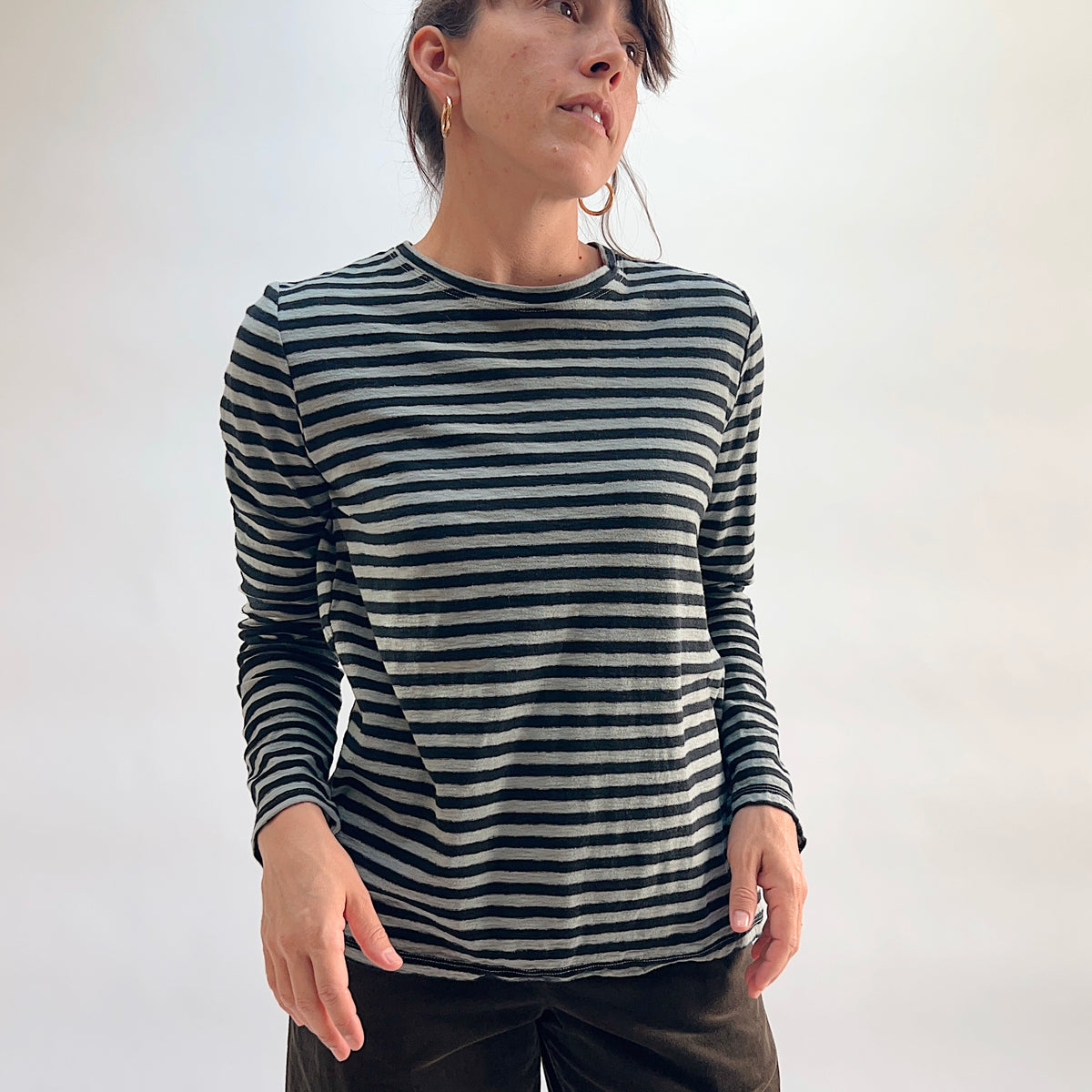 Cut Loose Striped Long Sleeve Easy Tee in Squirrel, black and grey horizontal stripe cotton-linen crewneck tee, worn with dark wide-leg trousers — front view, relaxed fit
