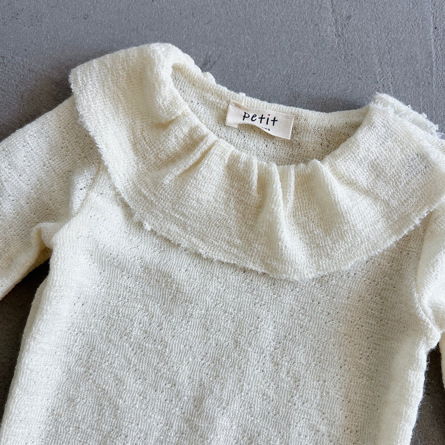 Merino Wool Onesie with Ruffle Collar in Raw White