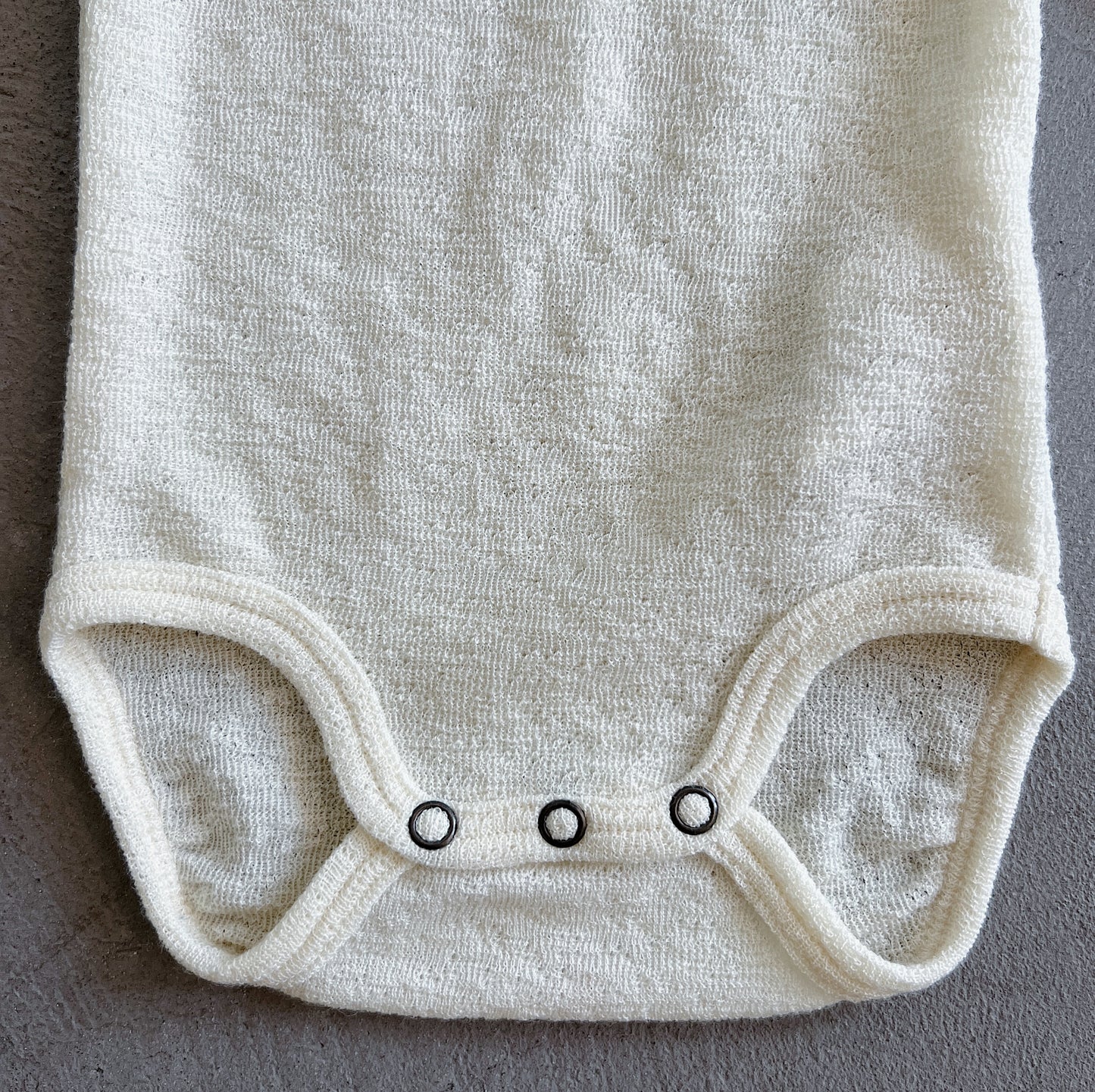 Merino Wool Onesie with Ruffle Collar in Raw White
